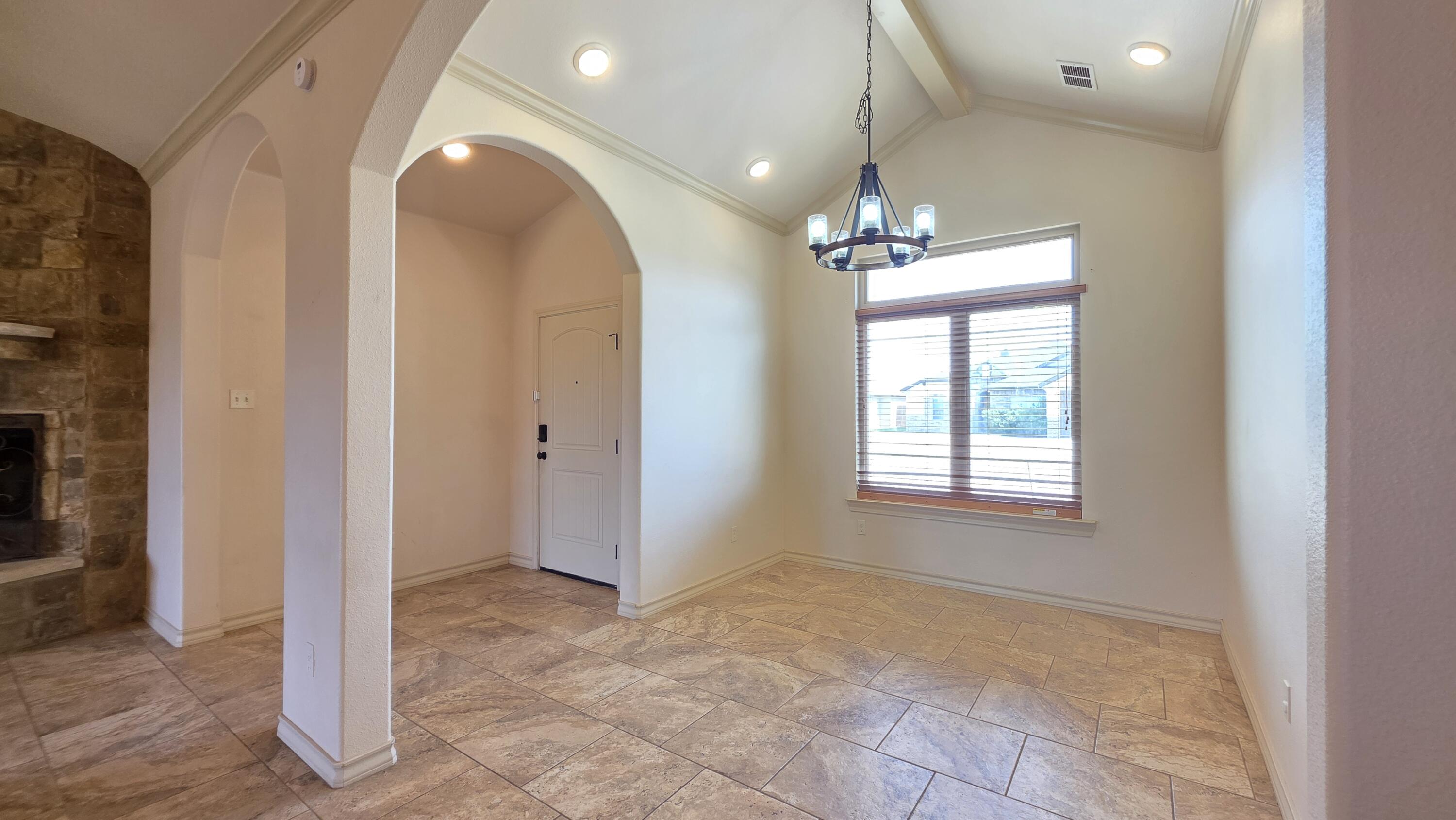 5234 Kemper Street Lubbock, TX 79416 - Photo 3 of 28 a view of a livingroom with a chandelier