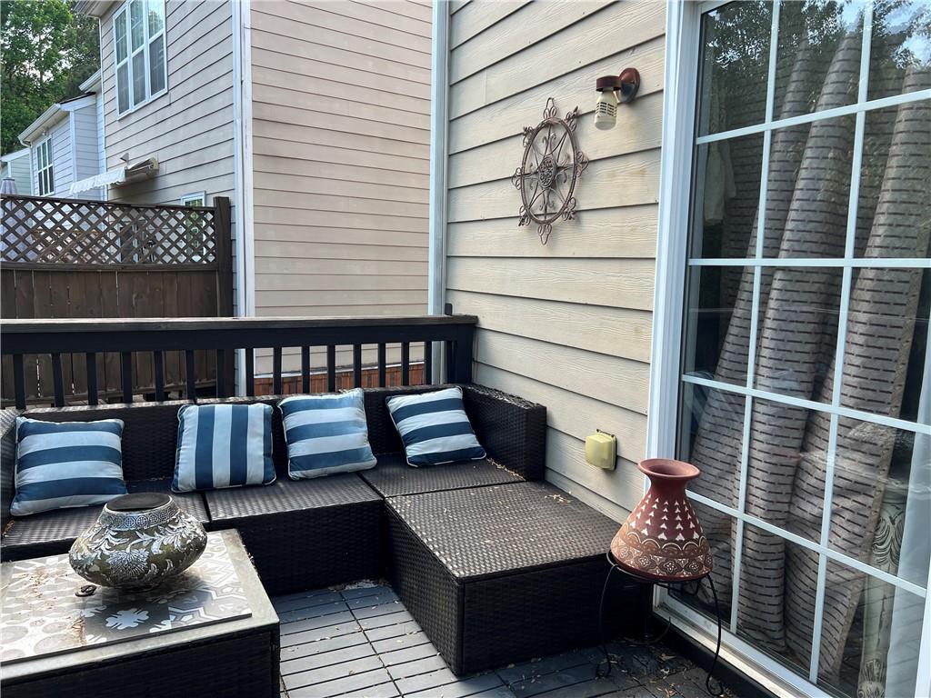 3914 Howell Park Road Duluth, GA 30096 - Photo 28 of 33 a balcony with wooden floor and a potted plant