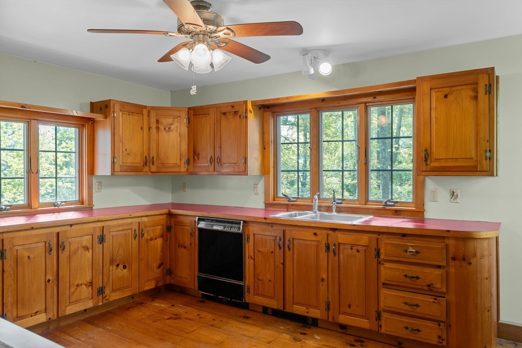 362 Snows Pond Road Rochester, MA 02770 - Photo 9 of 41 a kitchen with a sink and large window