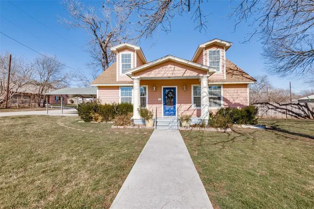 a front view of a house with yard