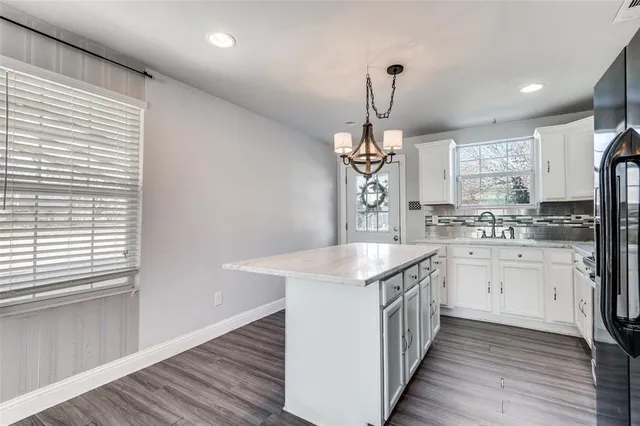 a kitchen with stainless steel appliances a refrigerator and a sink