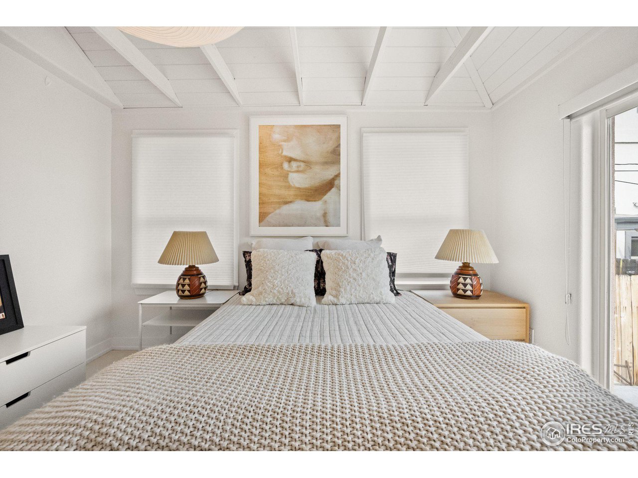 3244 Vallejo Street Denver, CO 80211 - Photo 10 of 32 a bedroom with a bed and a large window