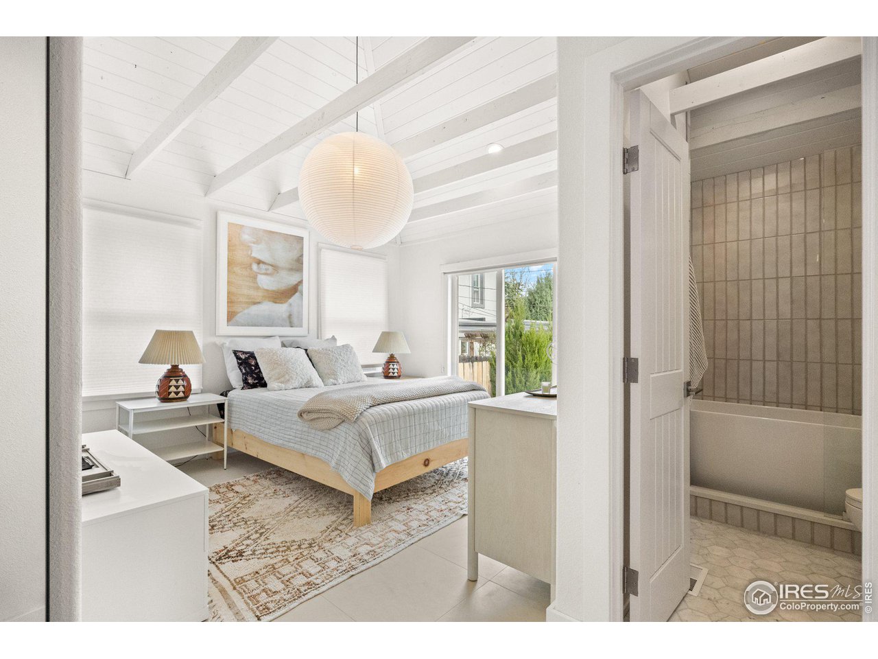 3244 Vallejo Street Denver, CO 80211 - Photo 11 of 32 a living room with furniture and a large window