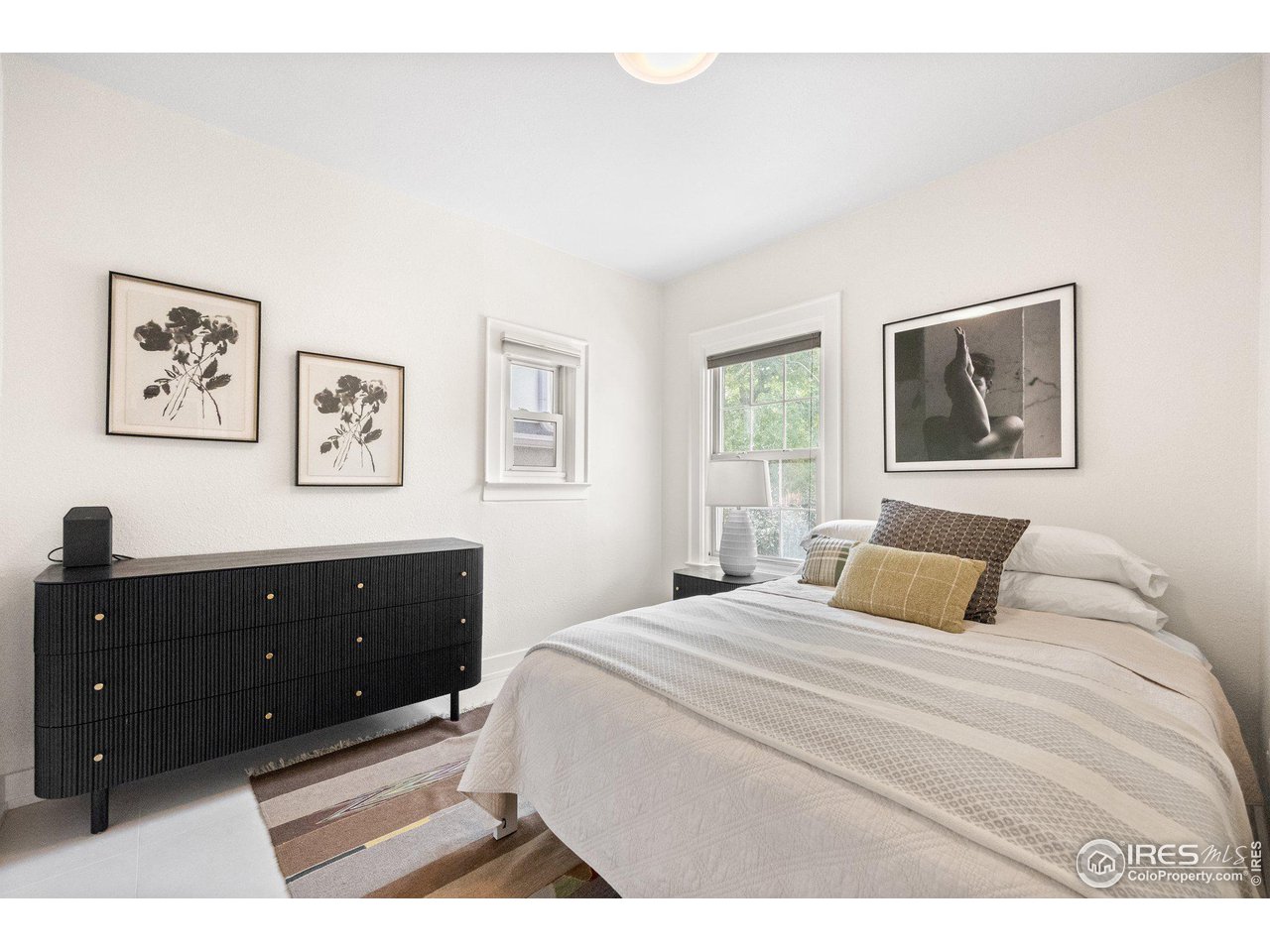 3244 Vallejo Street Denver, CO 80211 - Photo 13 of 32 a bedroom with a bed and a window