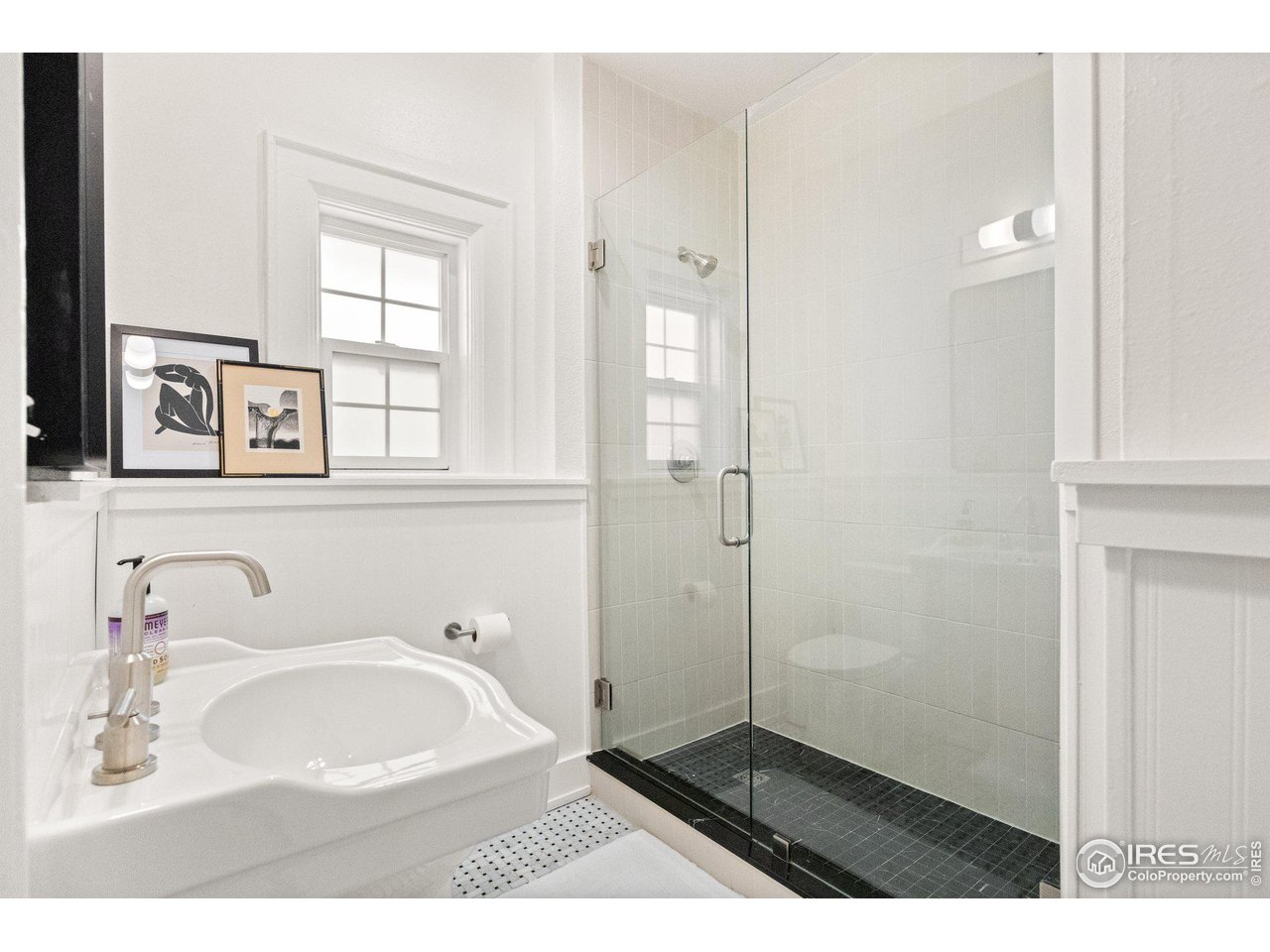 3244 Vallejo Street Denver, CO 80211 - Photo 15 of 32 a bathroom with a sink and a mirror