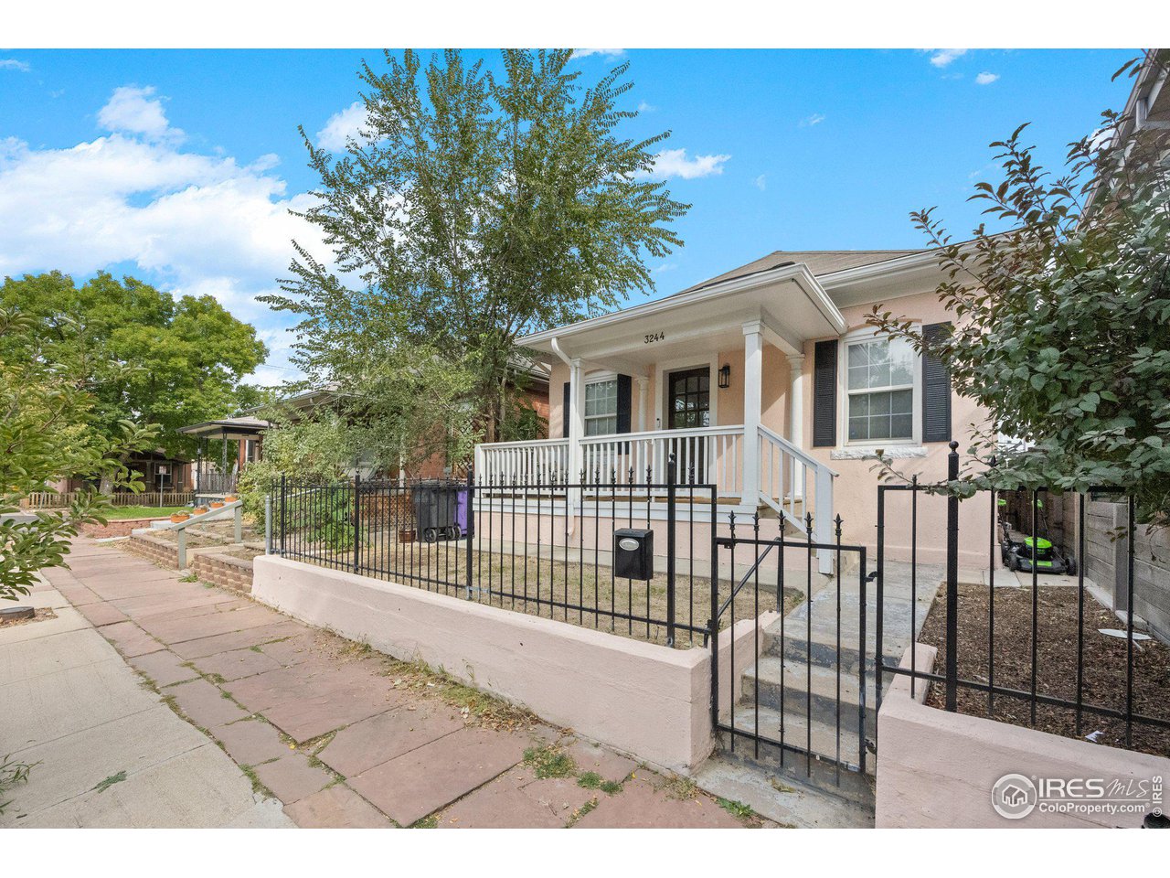 3244 Vallejo Street Denver, CO 80211 - Photo 24 of 32 a view of a house with a wooden fence