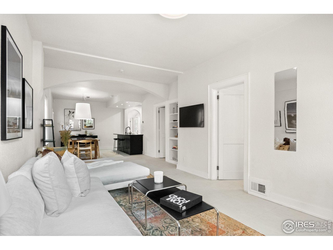 3244 Vallejo Street Denver, CO 80211 - Photo 4 of 32 a living room with furniture and a flat screen tv