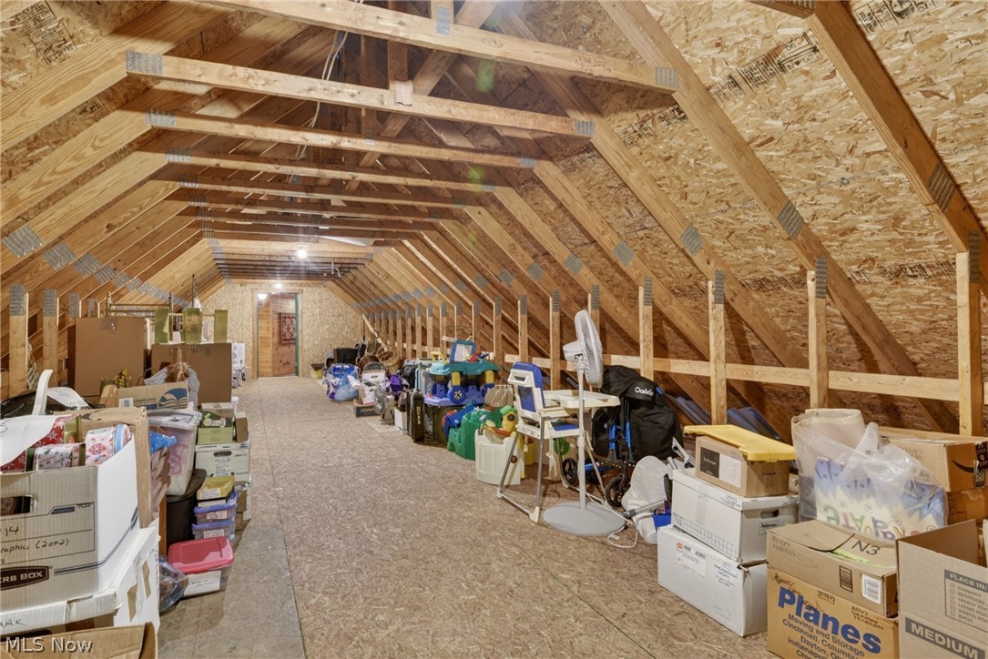16727 Pitts Road Wellington, OH 44090 - Photo 29 of 50 Unfinished storage attic also accessible from the garage with a pull-down ladder