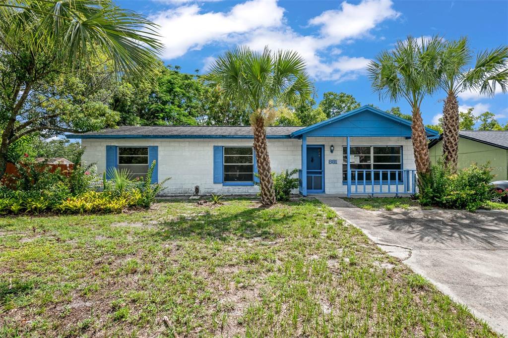 881 Kimball Drive Ocoee, FL 34761 - Photo 1 of 1 a front view of a house with a garden