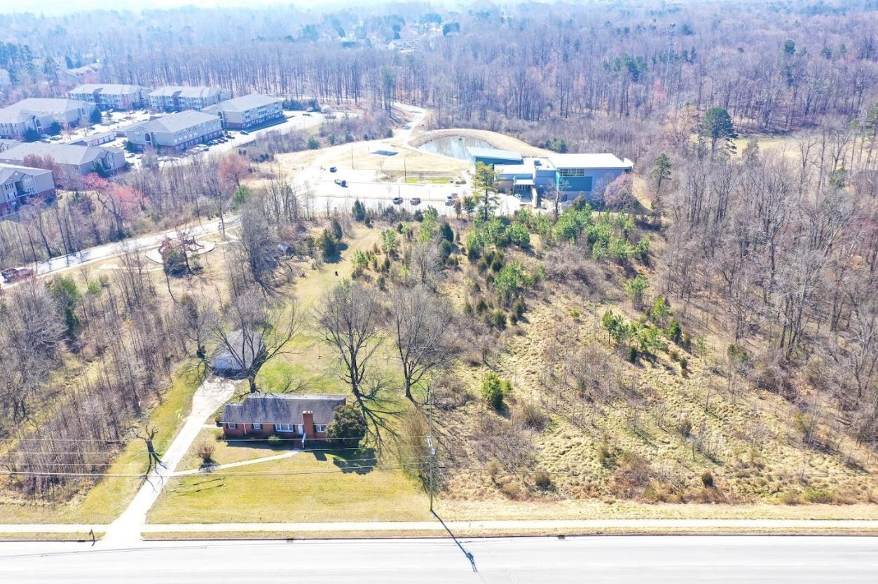 5309 Hilltop Road Greensboro, NC 27407 - Photo 4 of 8 a view of a yard with an outdoor space
