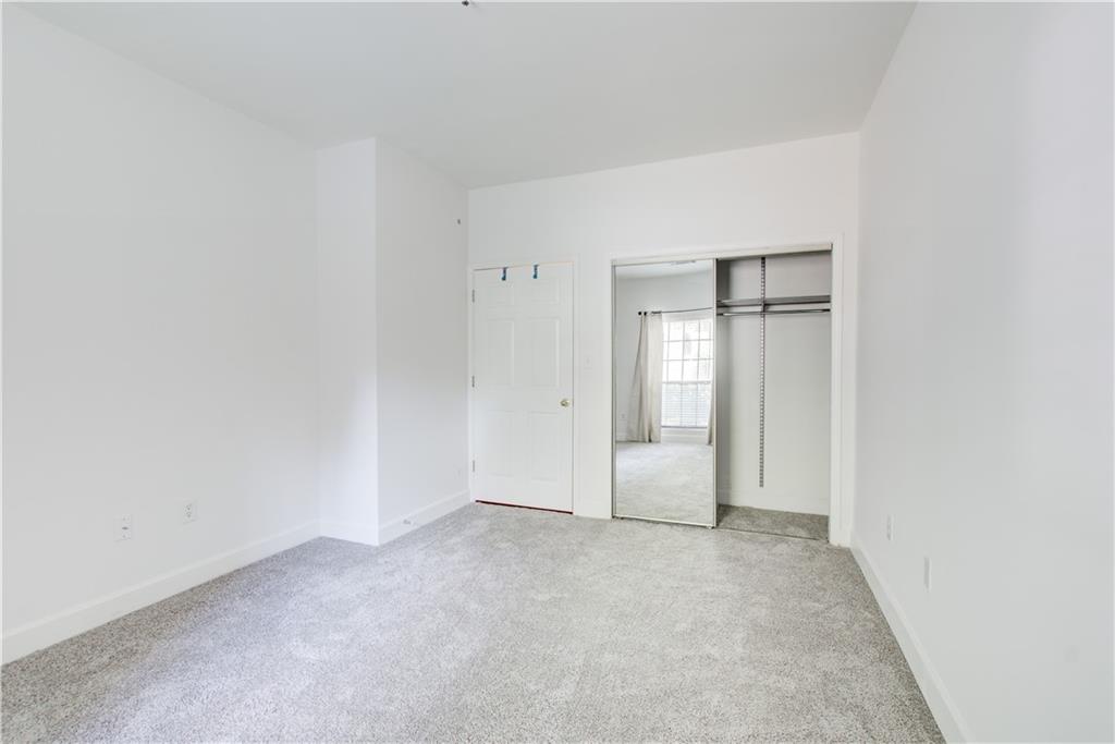 2865 Lenox Road Northeast, Unit 102 Atlanta, GA 30324 - Photo 13 of 35 a view of an empty room