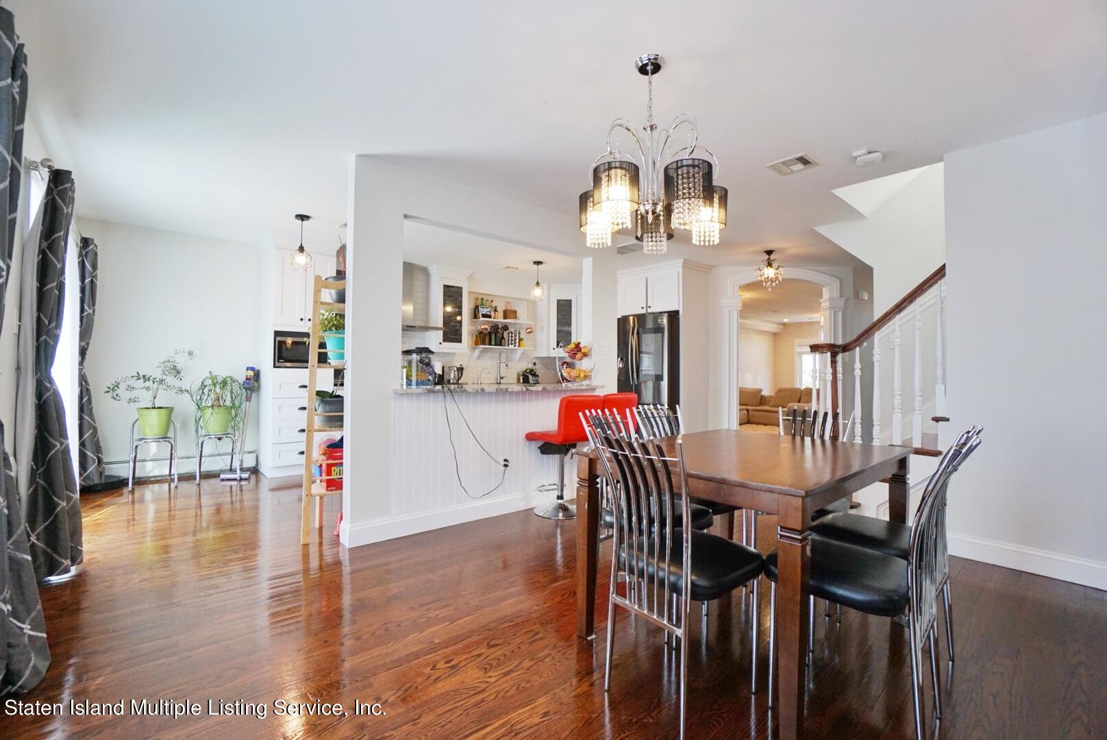 118 Covington Circle Staten Island, NY 10312 - Photo 12 of 41 (12) DINING ROOM WITH FIREPLACE