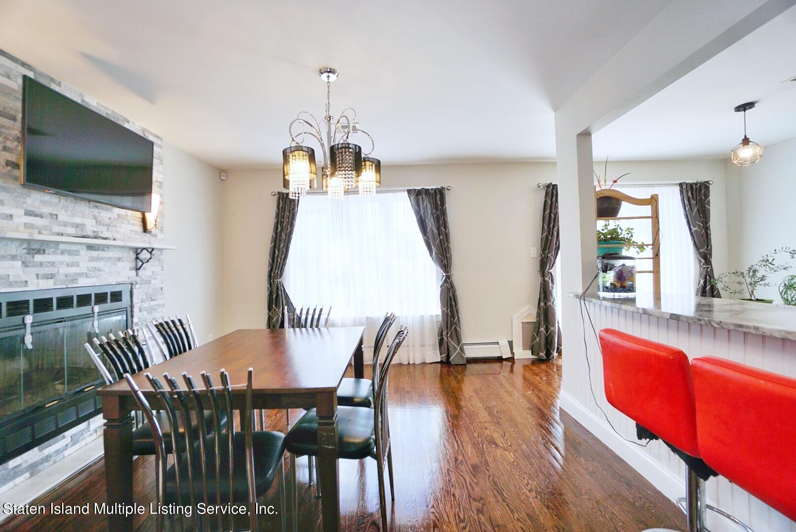 118 Covington Circle Staten Island, NY 10312 - Photo 13 of 41 (13) DINING ROOM WITH FIREPLACE