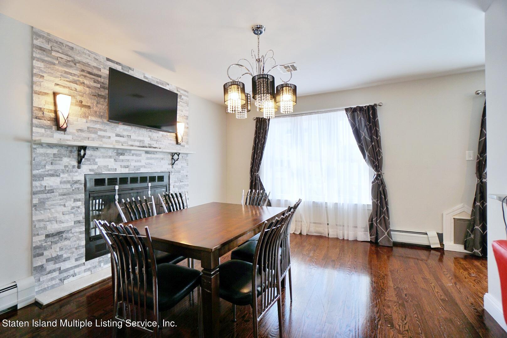118 Covington Circle Staten Island, NY 10312 - Photo 14 of 41 (14) DINING ROOM WITH FIREPLACE