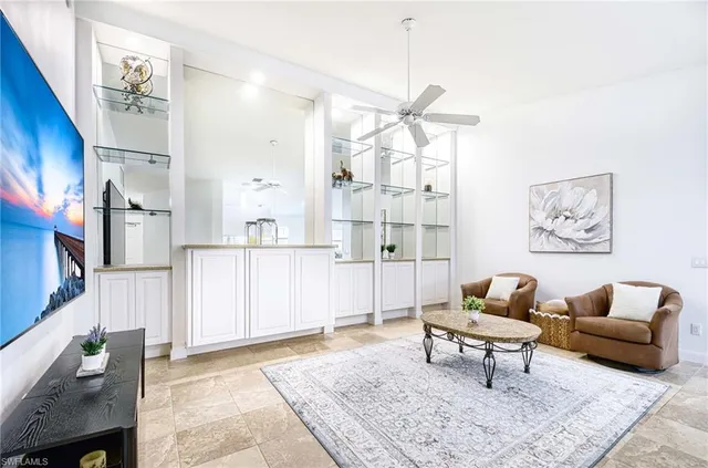 a living room with furniture and a rug