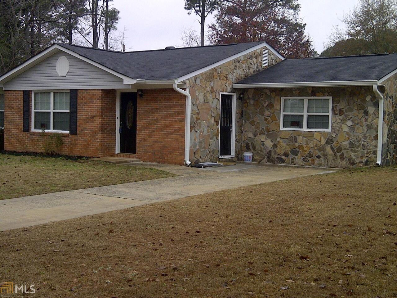 1694 Kinglet Road Hampton, GA 30228 - Photo 1 of 1 a front view of a house with a garden