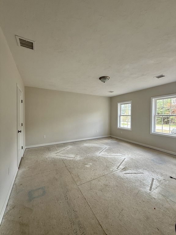 1 A Dudley Road Townsend, MA 01469 - Photo 11 of 17 an empty room with windows and closet