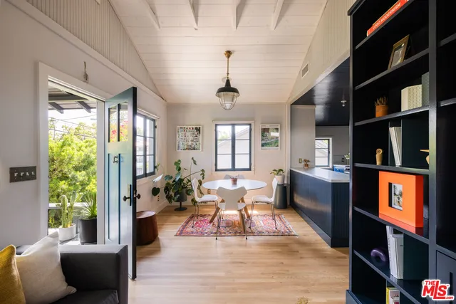 a living room with furniture window and wooden floor