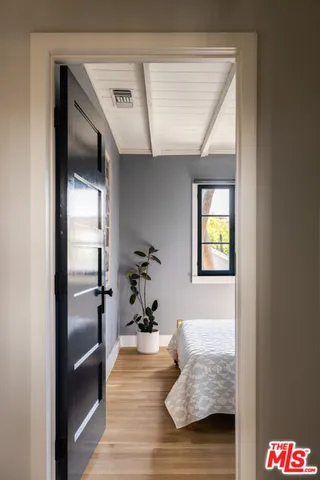 a hallway with furniture and a gate