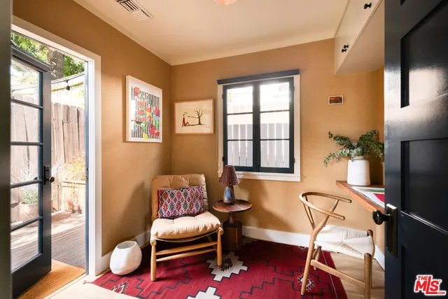 a workspace with furniture and a window