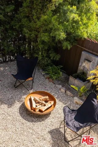 a view of a swimming pool with sitting area