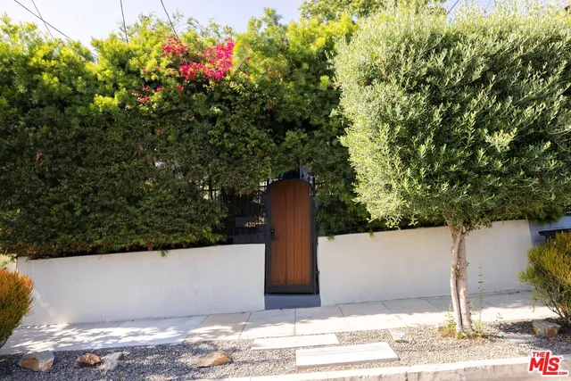 a black and white photo of a bench