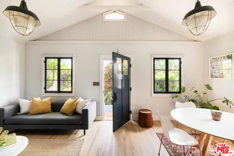 a living room with furniture and window