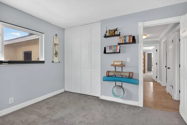 a view of a livingroom with furniture and hardwood floor