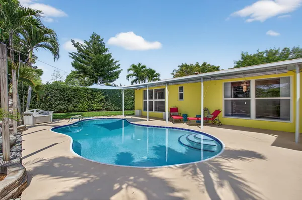 a view of a swimming pool with a patio