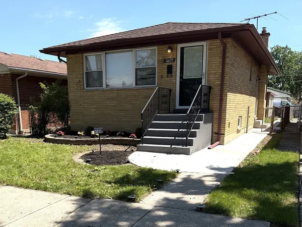 a view of house with yard outdoor seating and entertaining space