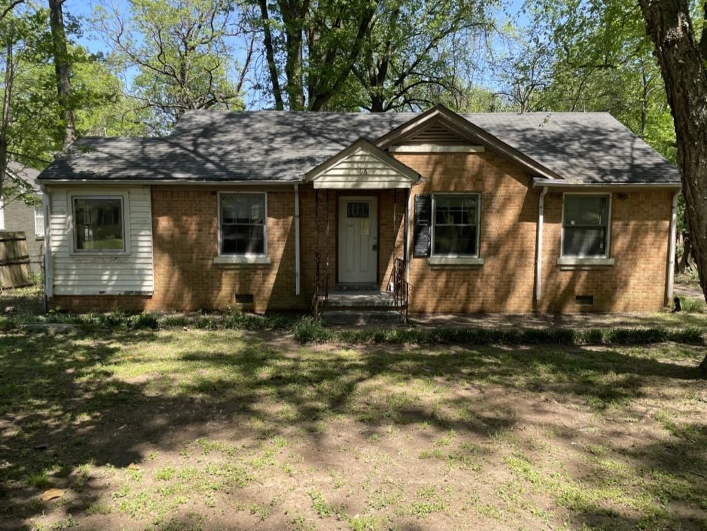 966 Goodman Street Memphis, TN 38111 - Photo 1 of 25 a front view of a house with a yard