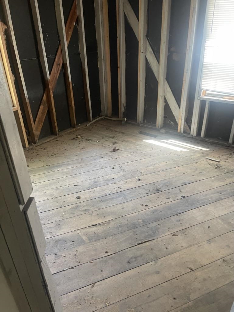 966 Goodman Street Memphis, TN 38111 - Photo 11 of 25 a view of an empty room with wooden floor