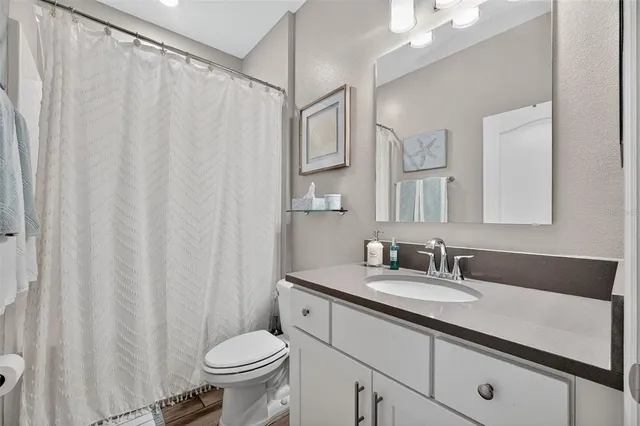 a living room with patio area and a garden