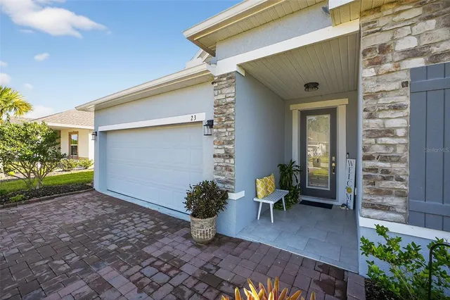an empty room with wooden floor cabinet and front door