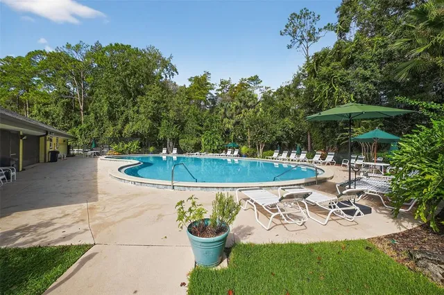 a view of outdoor space with seating area and car parked