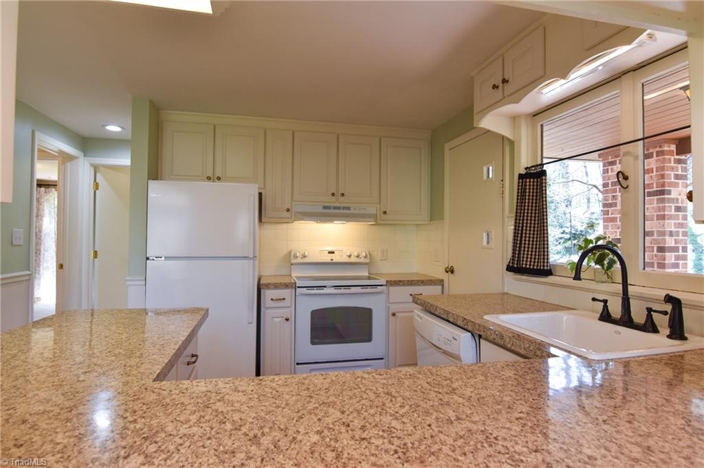 8390 Whipporwill Lane Rural Hall, NC 27045 - Photo 3 of 40 Kitchen with new Kohler sink! Door to covered porch - parking!