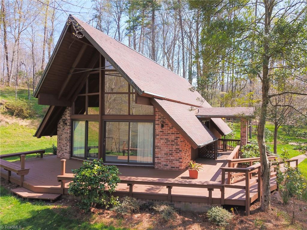 8390 Whipporwill Lane Rural Hall, NC 27045 - Photo 40 of 40 Oversized deck great for entertaining! Also replaced some decking boards! But stopped due to weather!