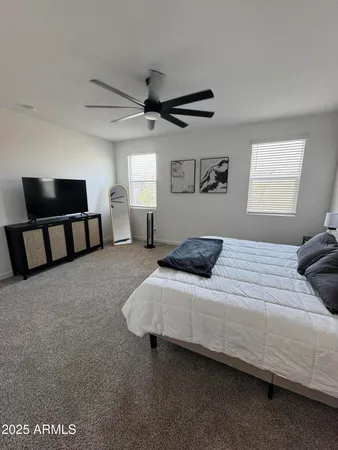 a bedroom with a bed and window