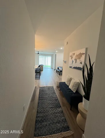 a living room with furniture and a rug