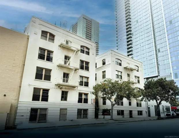 a view of a building with a yard