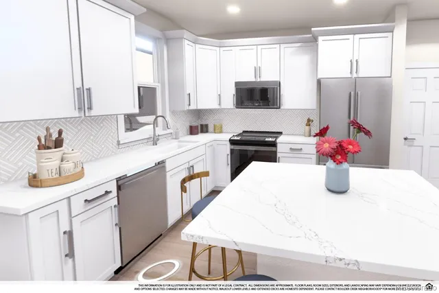 a kitchen with stainless steel appliances white cabinets a sink and a refrigerator