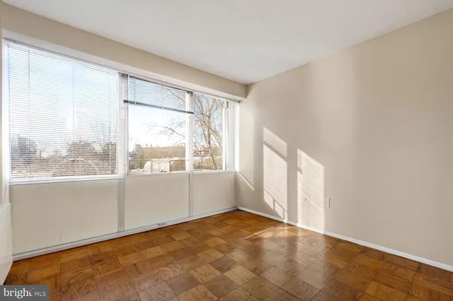a lobby with furniture and floor to ceiling window