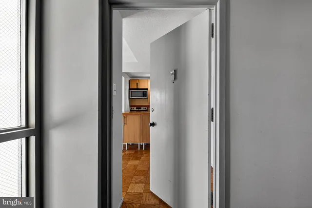 a view of a bedroom from a hallway