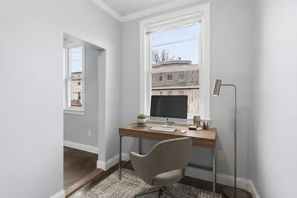 a view of workspace with wooden floor