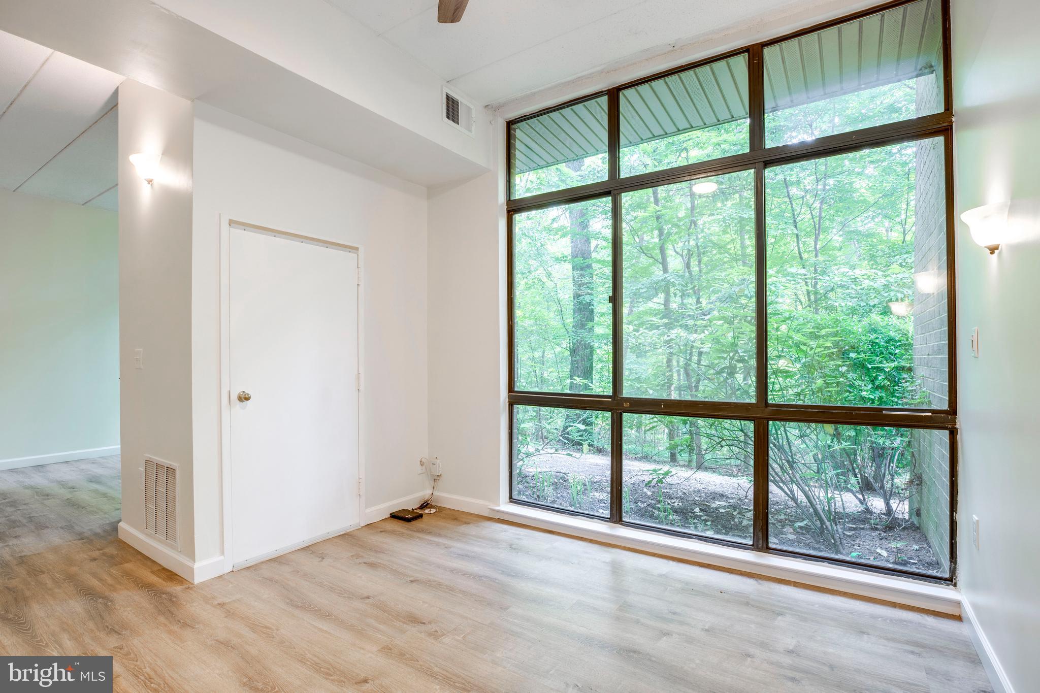 2106 Green Watch Way, Unit 101 Reston, VA 20191 - Photo 12 of 40 a view of an empty room and window