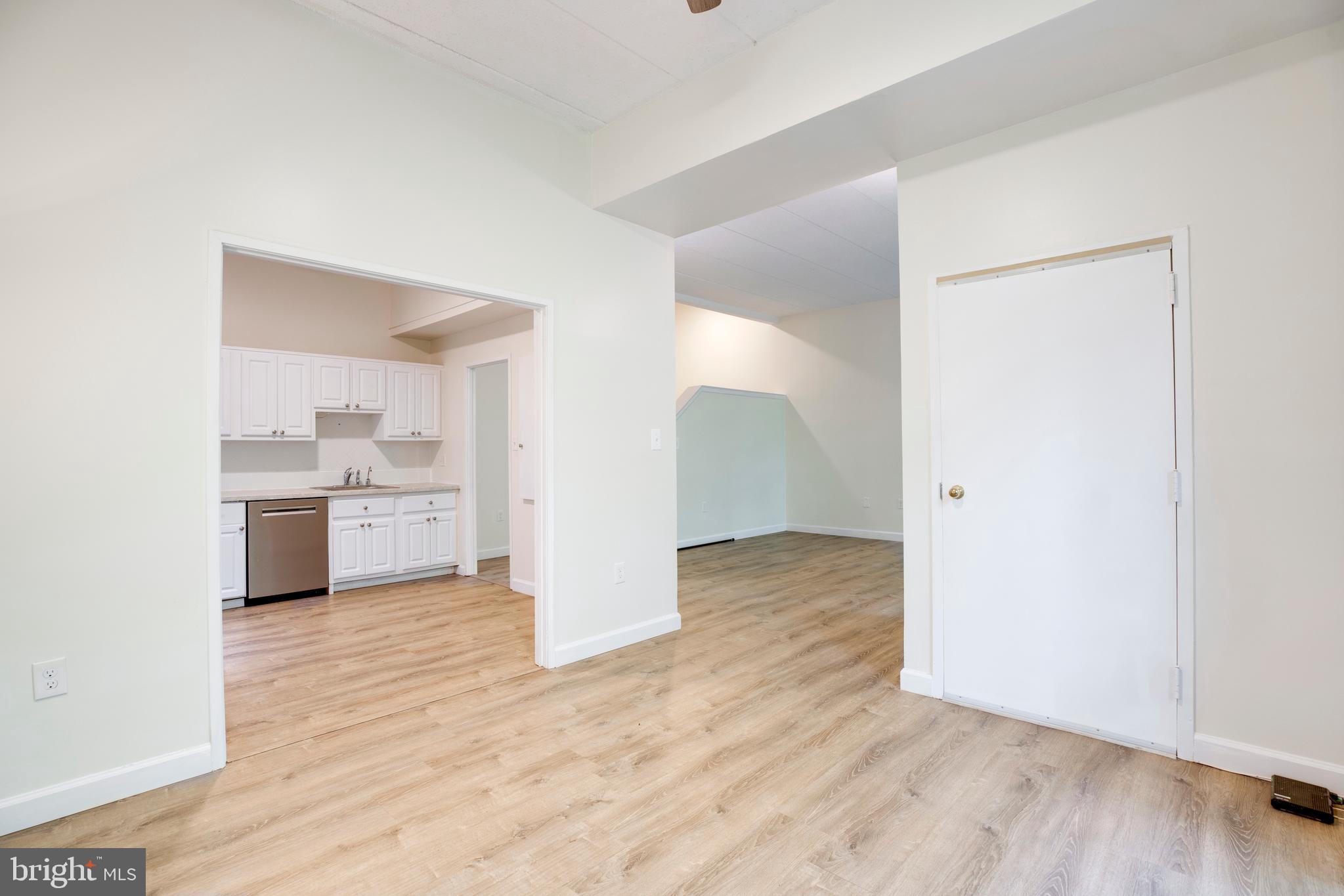 2106 Green Watch Way, Unit 101 Reston, VA 20191 - Photo 13 of 40 a view of a kitchen with a sink and a stove top oven