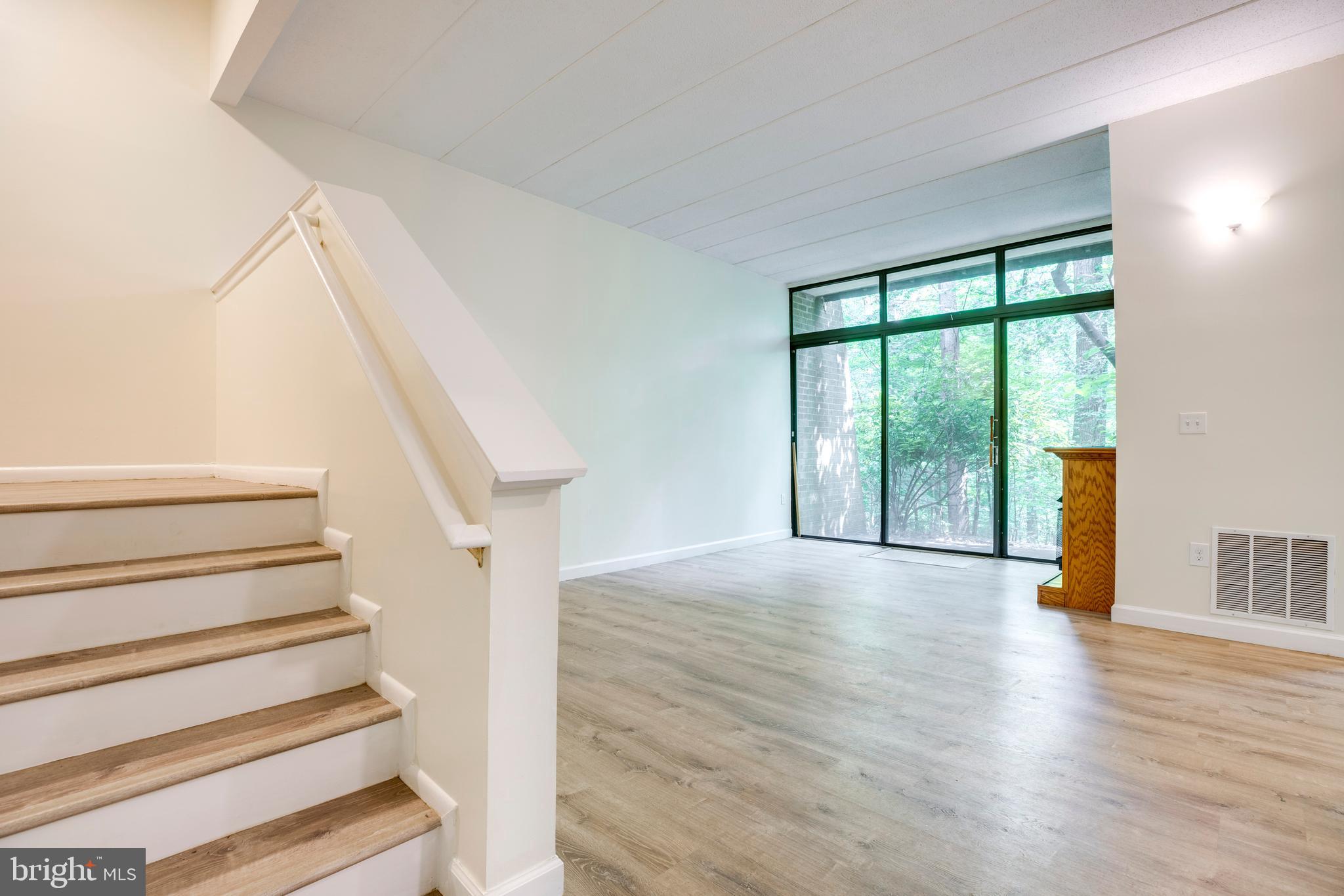 2106 Green Watch Way, Unit 101 Reston, VA 20191 - Photo 20 of 40 a view of an entryway with wooden floor and door