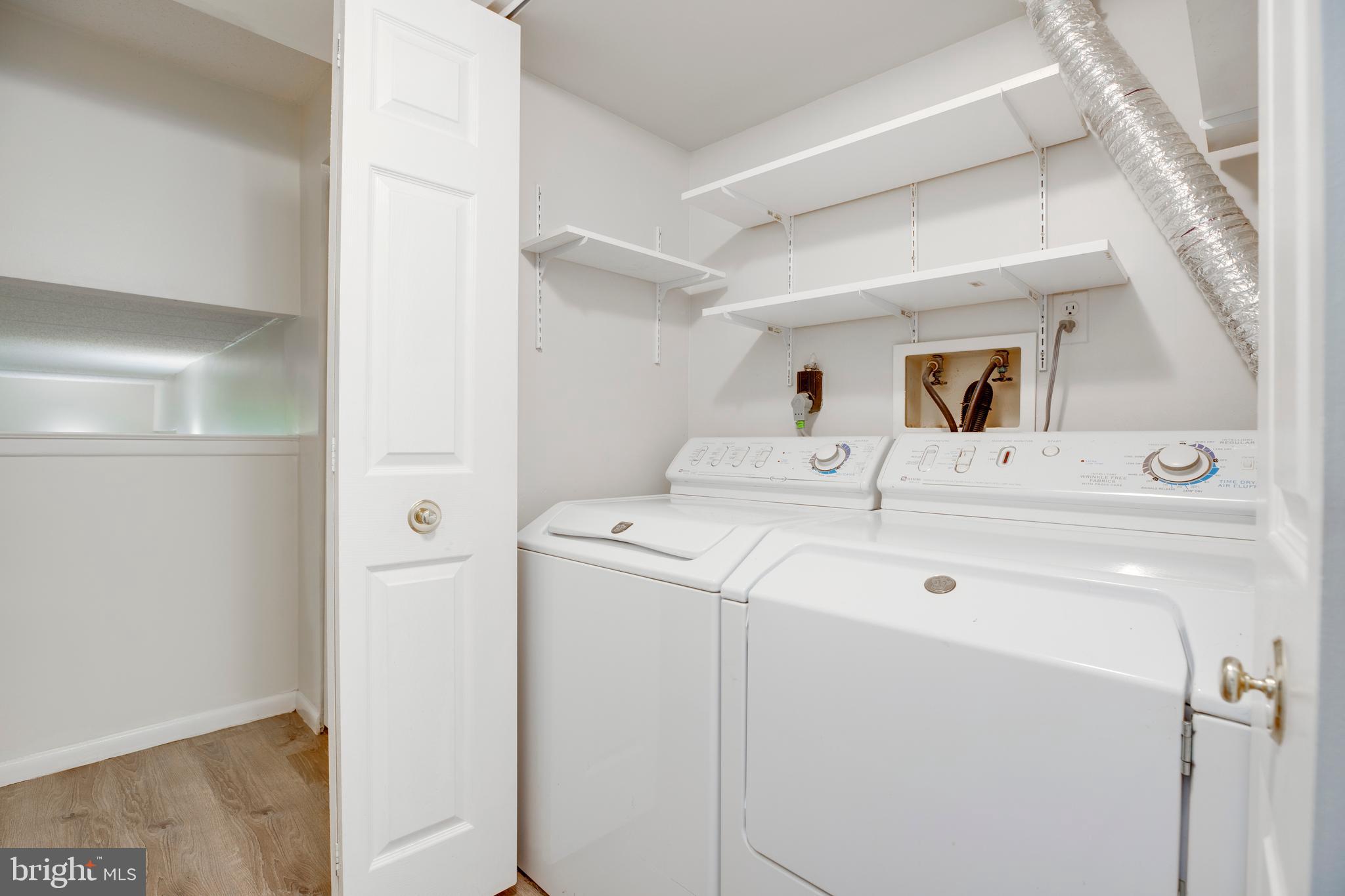 2106 Green Watch Way, Unit 101 Reston, VA 20191 - Photo 23 of 40 a utility room with dryer and washer