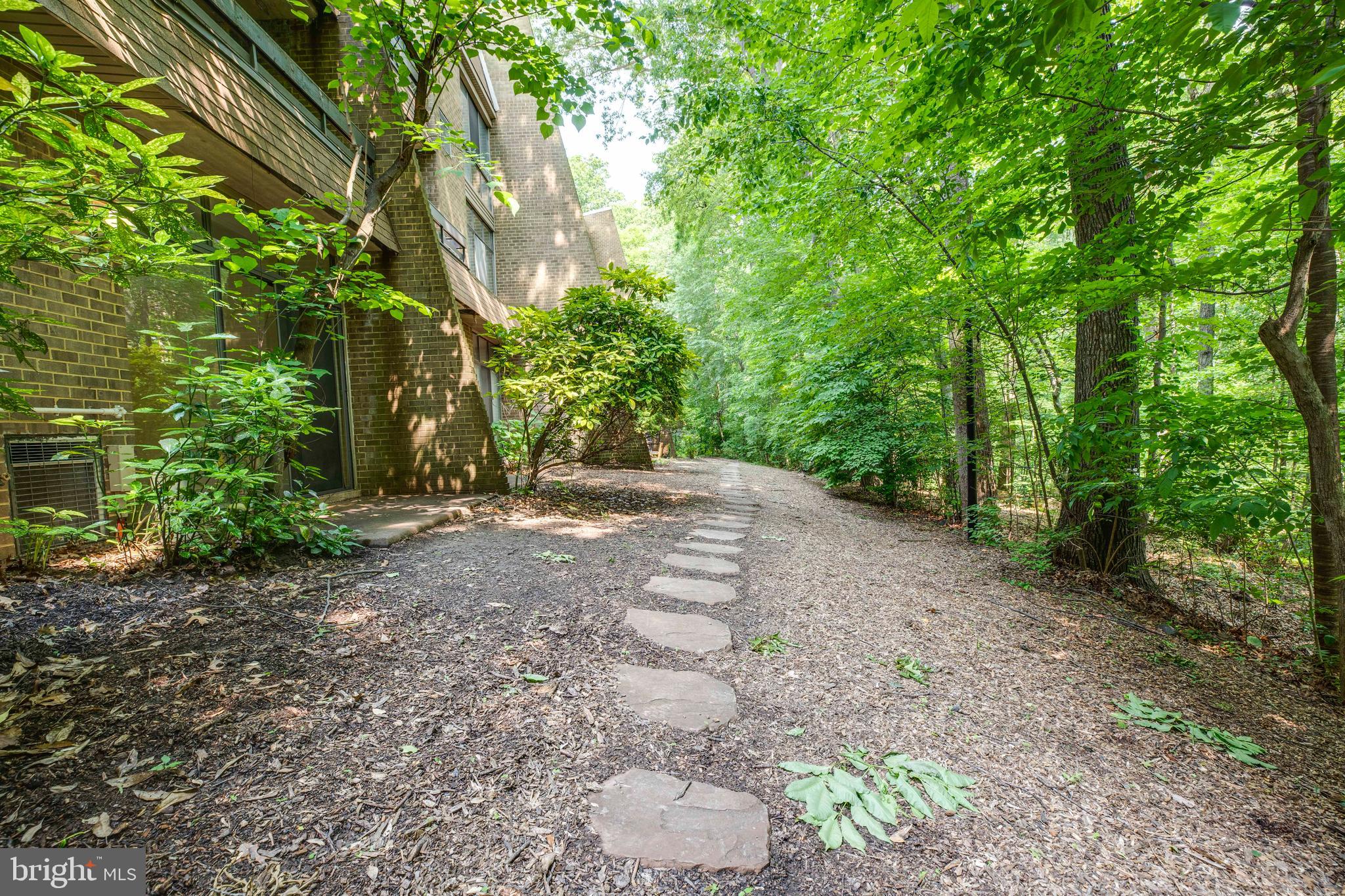 2106 Green Watch Way, Unit 101 Reston, VA 20191 - Photo 36 of 40 a view of a yard with plants and trees