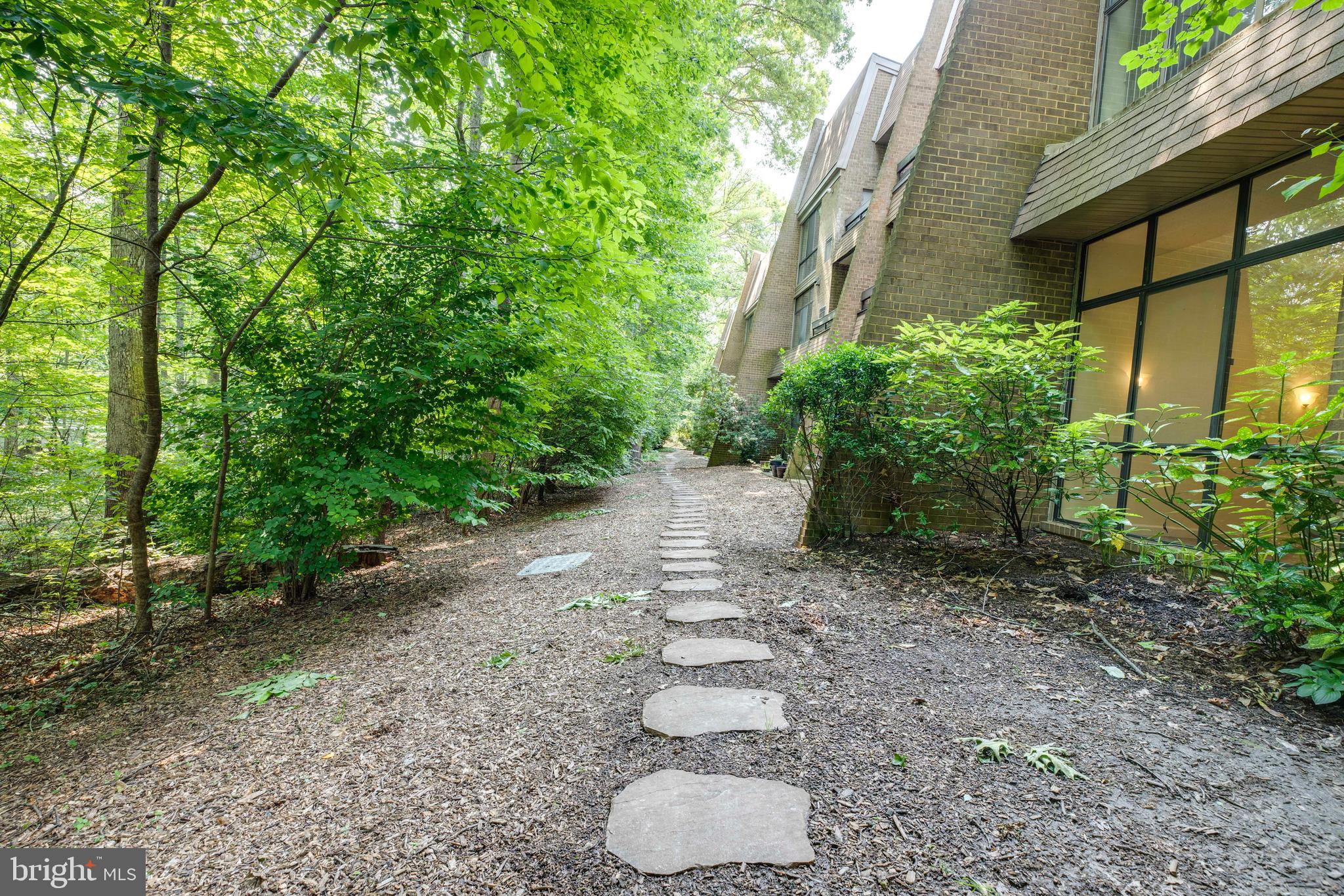 2106 Green Watch Way, Unit 101 Reston, VA 20191 - Photo 37 of 40 a backyard of a house with lots of green space